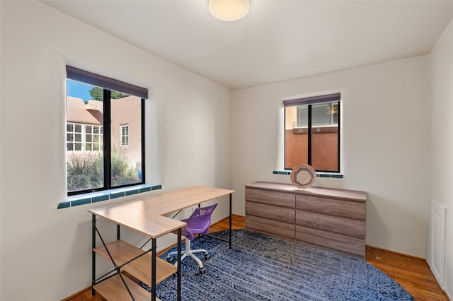 office with hardwood / wood-style flooring