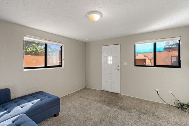 interior space featuring a textured ceiling