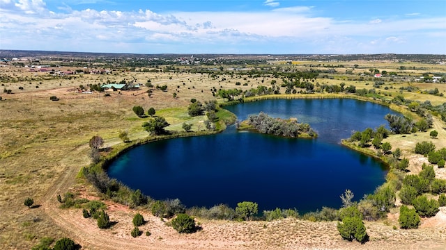 drone / aerial view featuring a rural view and a water view