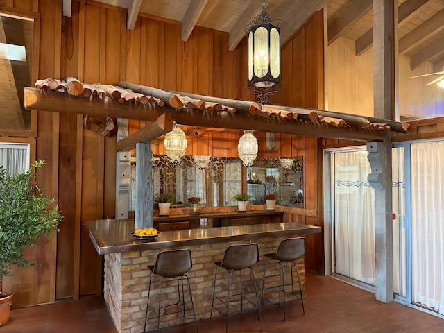 1017 River Rd, Santa Rosa, NM 88435 - indoor wet bar featuring wood walls and wood ceiling