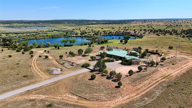 drone / aerial view featuring a water view and a rural view