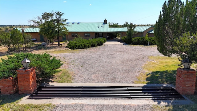 view of front facade with a carport