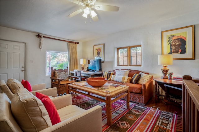 living room featuring a wealth of natural light and ceiling fan