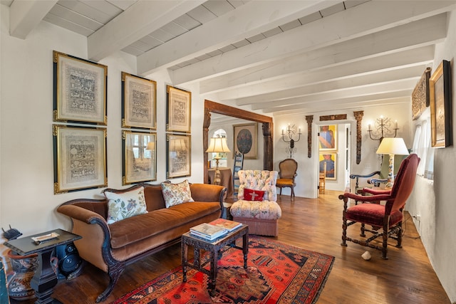 living room featuring beam ceiling and hardwood / wood-style flooring