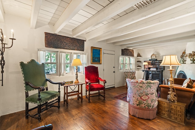 sitting room featuring beam ceiling and hardwood / wood-style floors