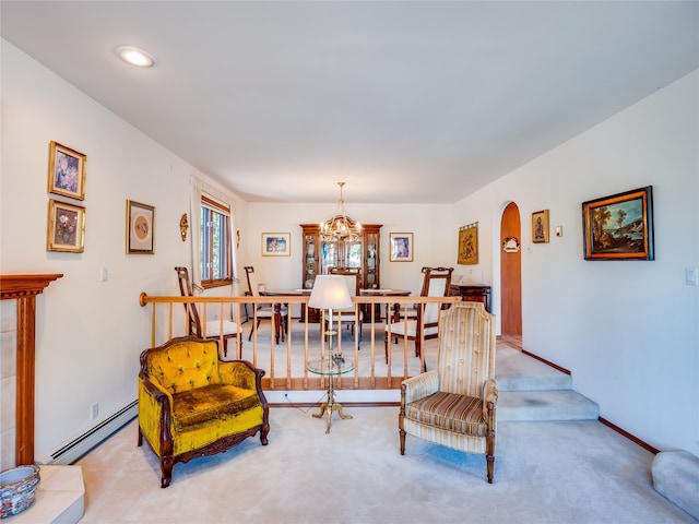 living room featuring light carpet, a baseboard radiator, and an inviting chandelier