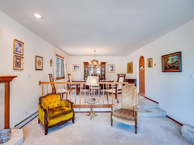 2176 La Tierra, Los Alamos, NM 87544 - living area with arched walkways, carpet, baseboard heating, and an inviting chandelier