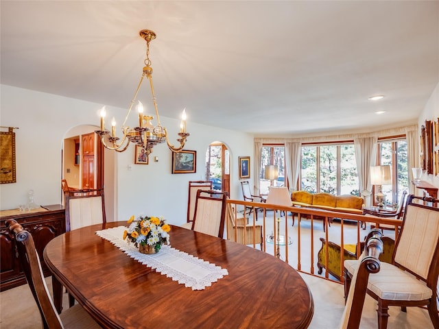 2176 La Tierra, Los Alamos, NM 87544 - dining space featuring a chandelier and arched walkways