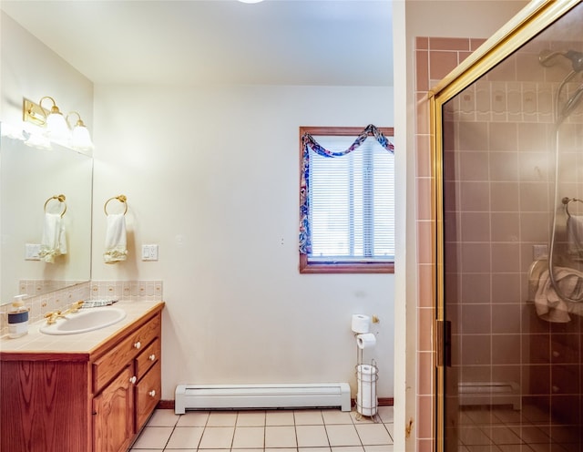 2176 La Tierra, Los Alamos, NM 87544 - bathroom featuring tile patterned floors, vanity, a baseboard heating unit, and a tile shower