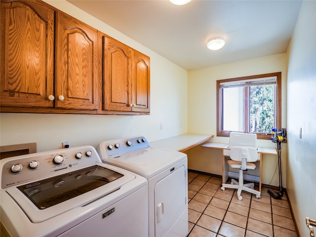 clothes washing area featuring cabinets, light tile patterned flooring, and separate washer and dryer