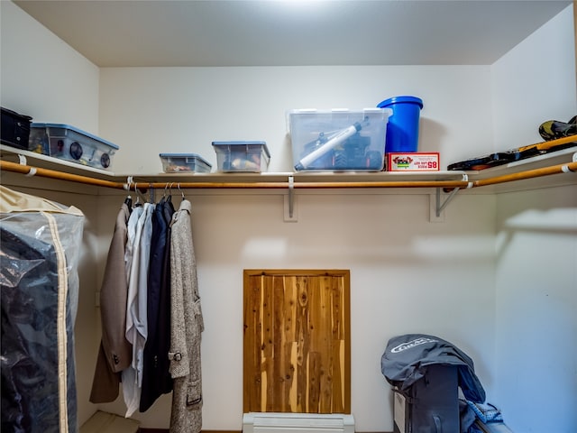 spacious closet featuring a baseboard radiator