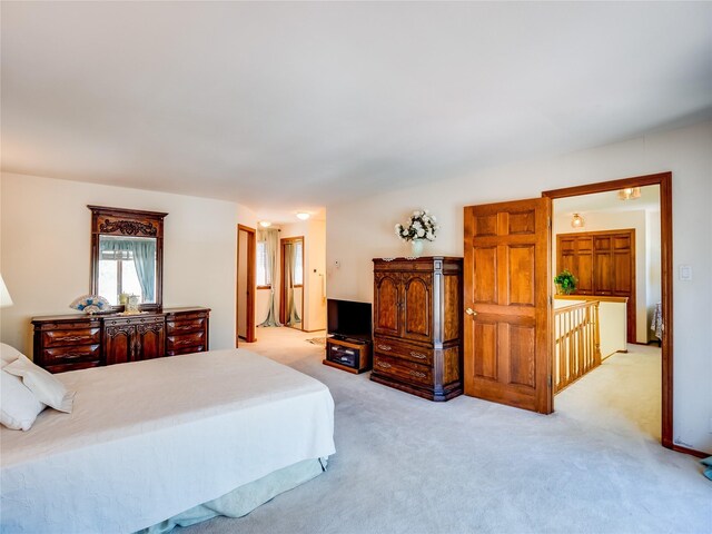 2176 La Tierra, Los Alamos, NM 87544 - bedroom featuring light carpet and connected bathroom