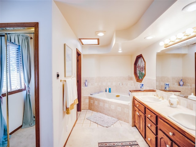 2176 La Tierra, Los Alamos, NM 87544 - full bath featuring tile patterned flooring, double vanity, a garden tub, and a sink