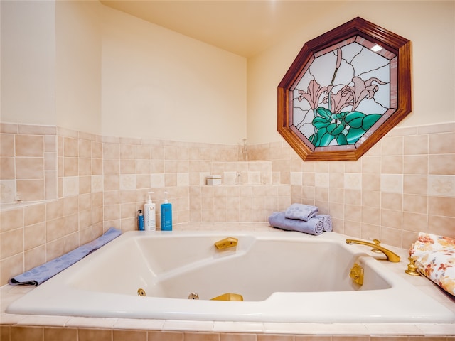 bathroom featuring tiled tub