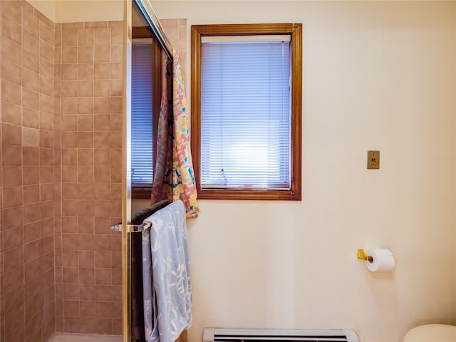 2176 La Tierra, Los Alamos, NM 87544 - bathroom featuring toilet, a baseboard radiator, and tiled shower