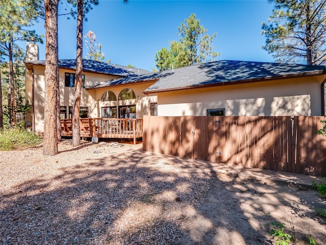 2176 La Tierra, Los Alamos, NM 87544 - back of house with stucco siding, a wooden deck, and a chimney