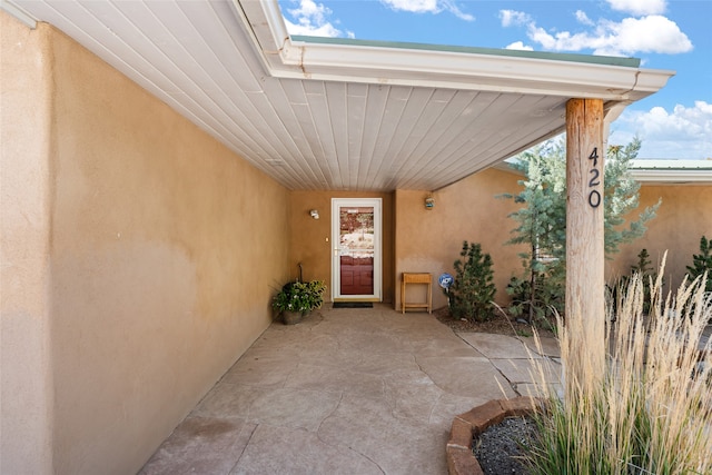 entrance to property with a patio