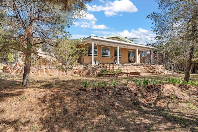 back of house with covered porch