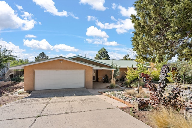 single story home with a garage