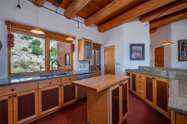 kitchen featuring dishwasher, beamed ceiling, sink, decorative light fixtures, and butcher block countertops