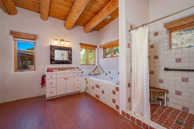 bathroom with beamed ceiling, plenty of natural light, vanity, and separate shower and tub