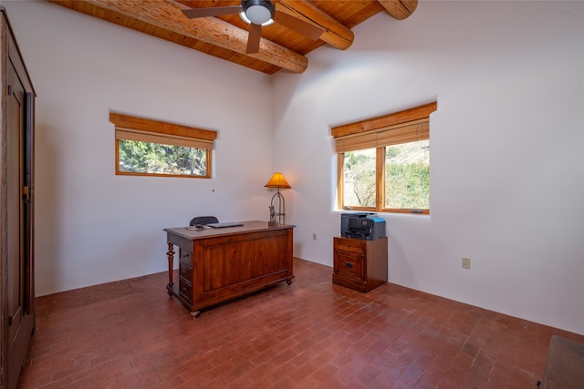 office area featuring ceiling fan, a towering ceiling, beam ceiling, and wooden ceiling