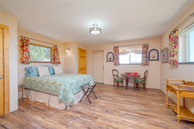 bedroom with hardwood / wood-style flooring