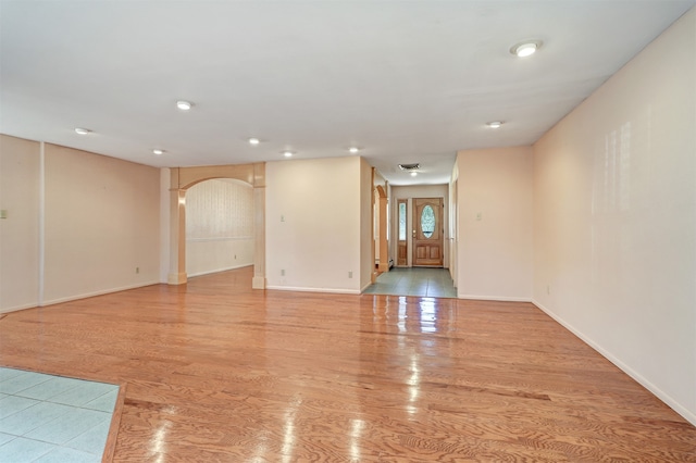 unfurnished room with light wood-type flooring