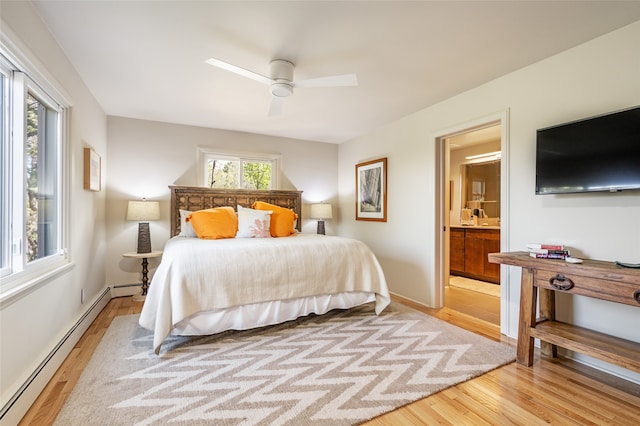 bedroom with a baseboard radiator, ensuite bath, ceiling fan, and light hardwood / wood-style flooring