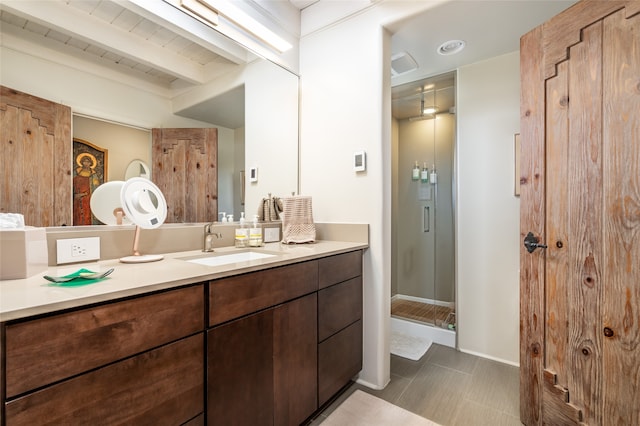 bathroom featuring vanity, a shower with door, beamed ceiling, and wood ceiling