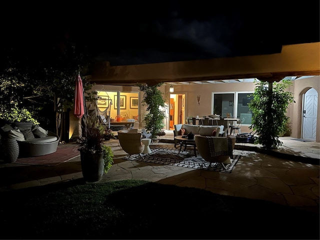 patio at night with an outdoor hangout area