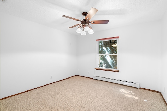 carpeted spare room with a textured ceiling, baseboard heating, and ceiling fan