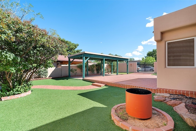 view of yard with a storage shed and a patio area