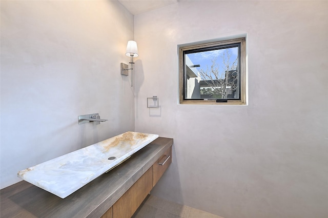 bathroom with tile patterned floors