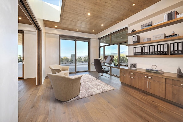 home office featuring wood-type flooring, built in desk, and wooden ceiling