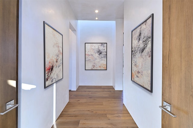 hallway featuring hardwood / wood-style flooring