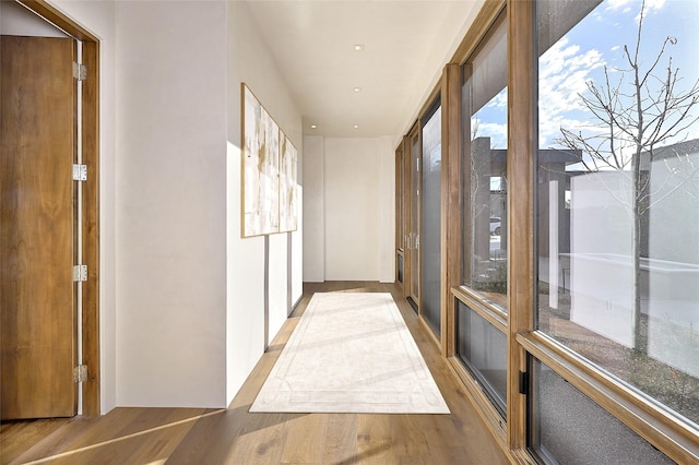 corridor with light wood-type flooring