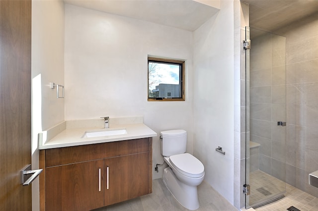 bathroom with walk in shower, tile patterned floors, vanity, and toilet