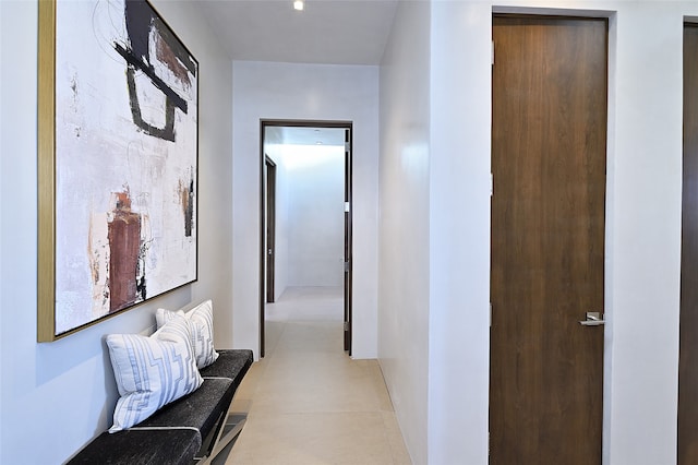 corridor featuring light tile patterned flooring