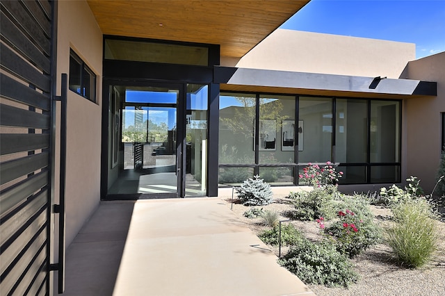 doorway to property with a patio