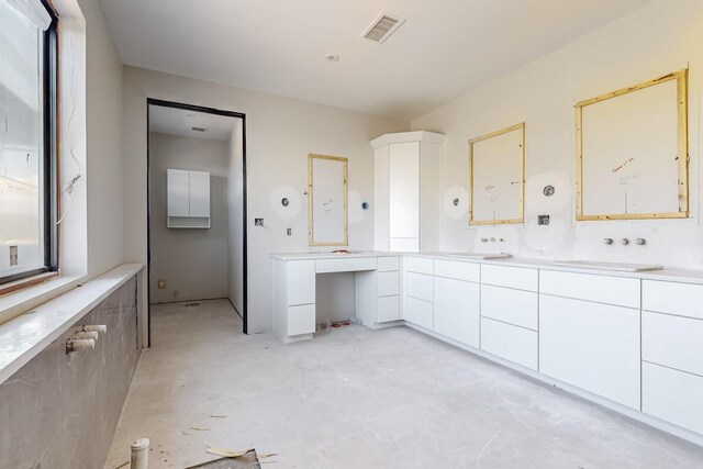 bathroom featuring vanity and concrete flooring