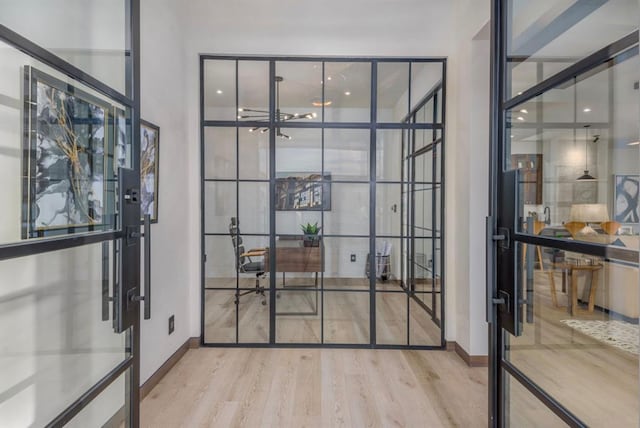 doorway to outside featuring light wood-type flooring