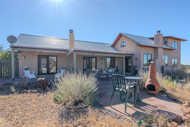 back of property featuring a patio