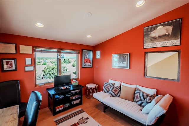 office space featuring hardwood / wood-style floors and vaulted ceiling