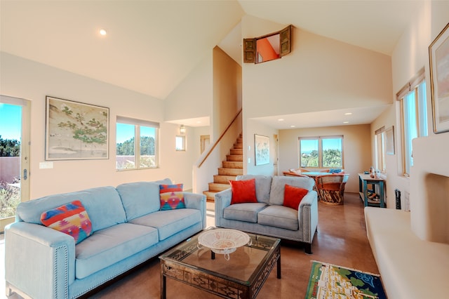 living room with high vaulted ceiling