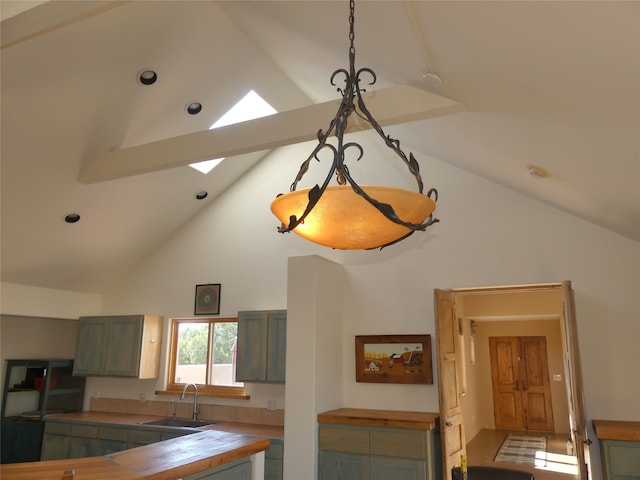 details featuring sink, a skylight, and butcher block countertops