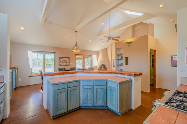 kitchen featuring vaulted ceiling with beams, hanging light fixtures, concrete floors, a center island, and ceiling fan