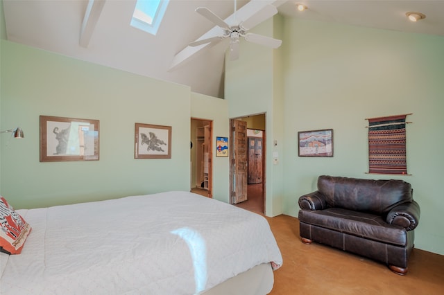 carpeted bedroom featuring ceiling fan, high vaulted ceiling, beamed ceiling, and a skylight