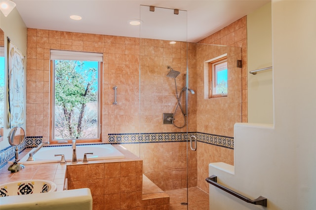 bathroom featuring plus walk in shower