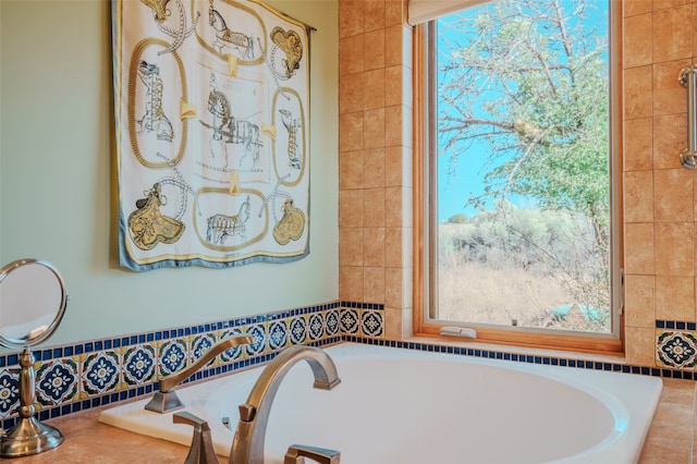 bathroom featuring tiled bath